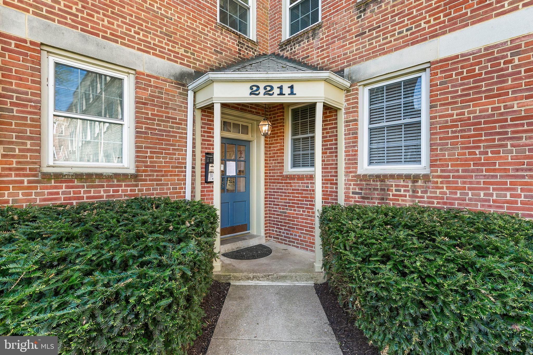 2211 Washington Avenue, Unit 303 Silver Spring, MD 20910 - Photo 4 of 28 a view of a brick house with large windows