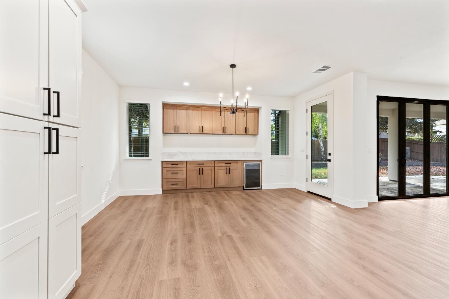 688 Cindy Drive Ripon, CA 95366 - Photo 14 of 57 a view of a kitchen with a sink cabinet and a living room