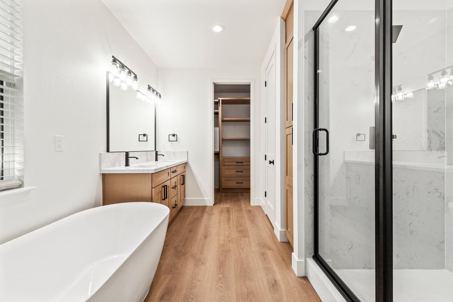 688 Cindy Drive Ripon, CA 95366 - Photo 25 of 57 a bathroom with a tub sink shower and a mirror