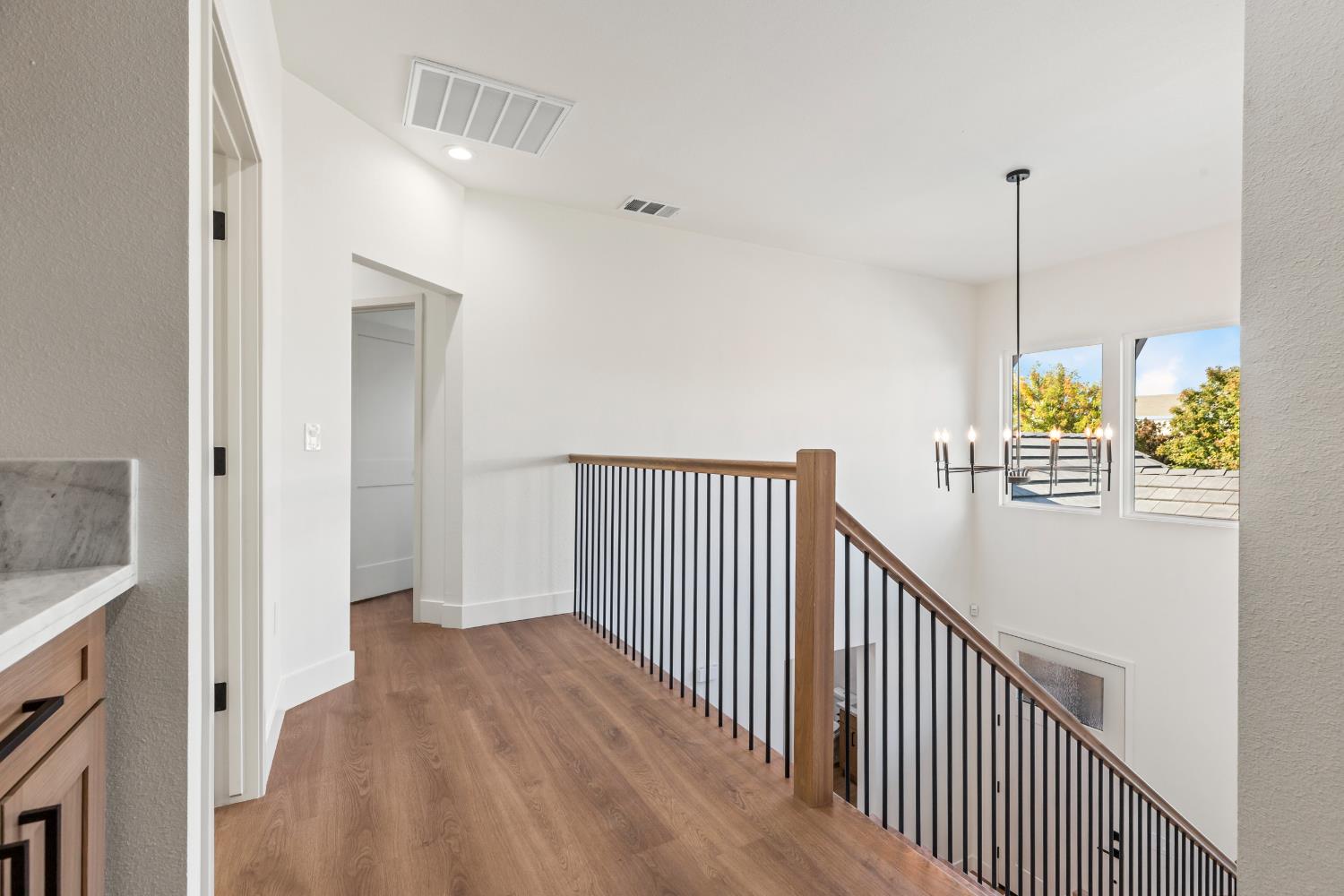 688 Cindy Drive Ripon, CA 95366 - Photo 31 of 57 a view of a hallway with wooden floor