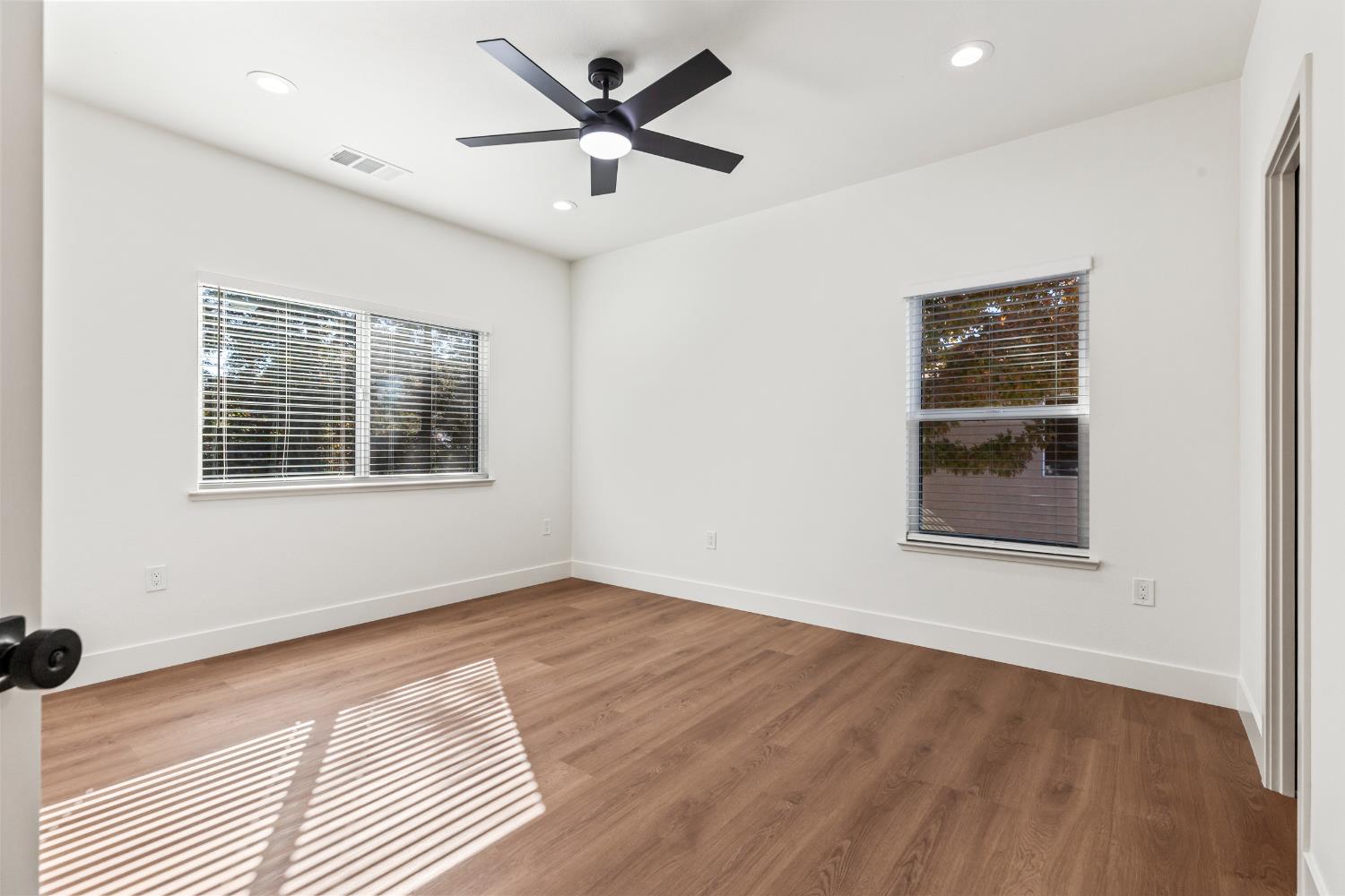 688 Cindy Drive Ripon, CA 95366 - Photo 35 of 57 wooden floor in an empty room with a window