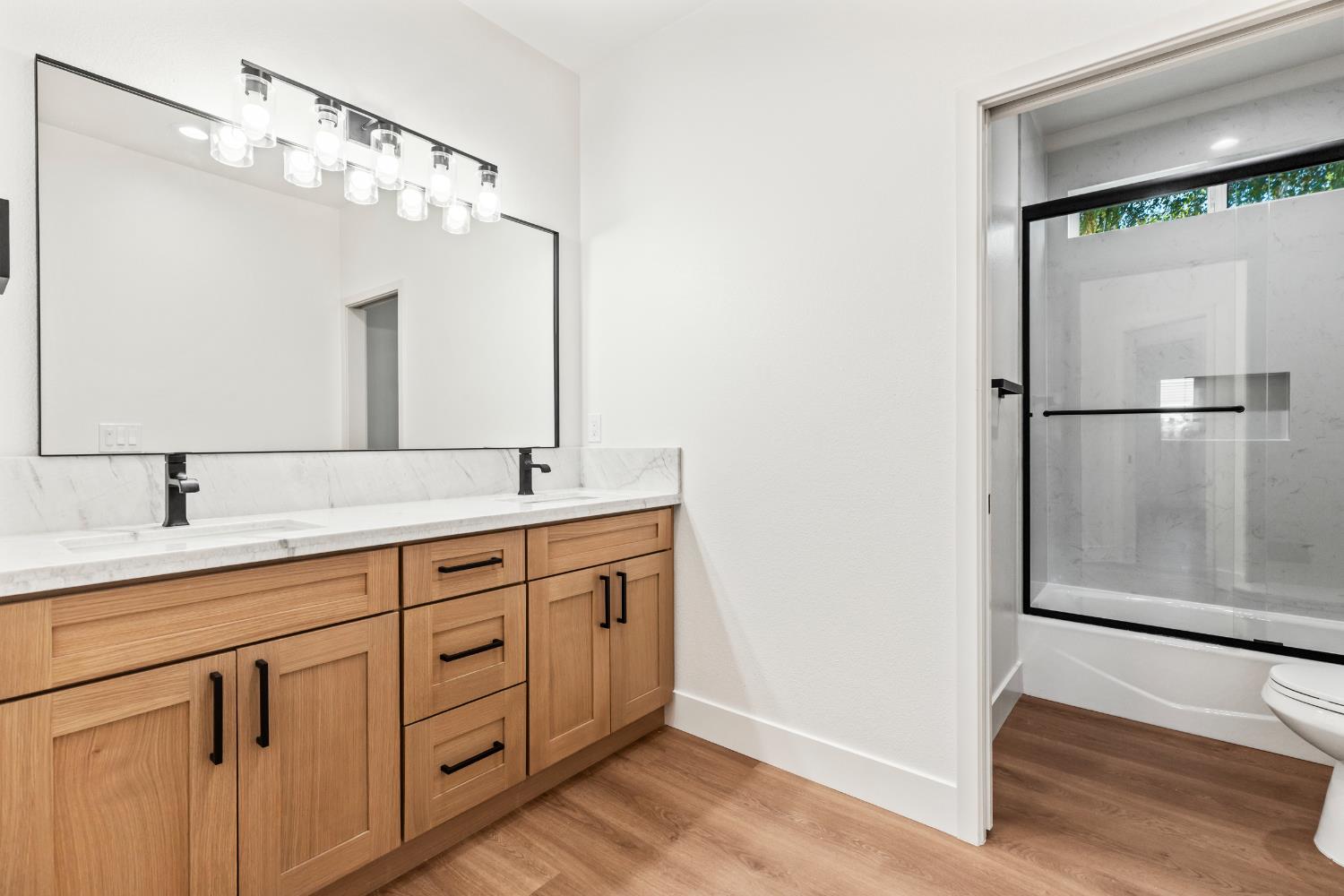 688 Cindy Drive Ripon, CA 95366 - Photo 36 of 57 a bathroom with a double vanity sink and mirror