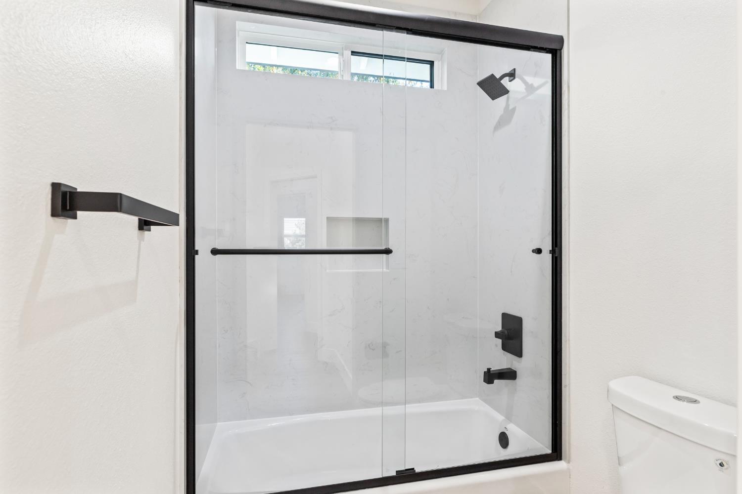 688 Cindy Drive Ripon, CA 95366 - Photo 37 of 57 a bathroom with a glass shower door