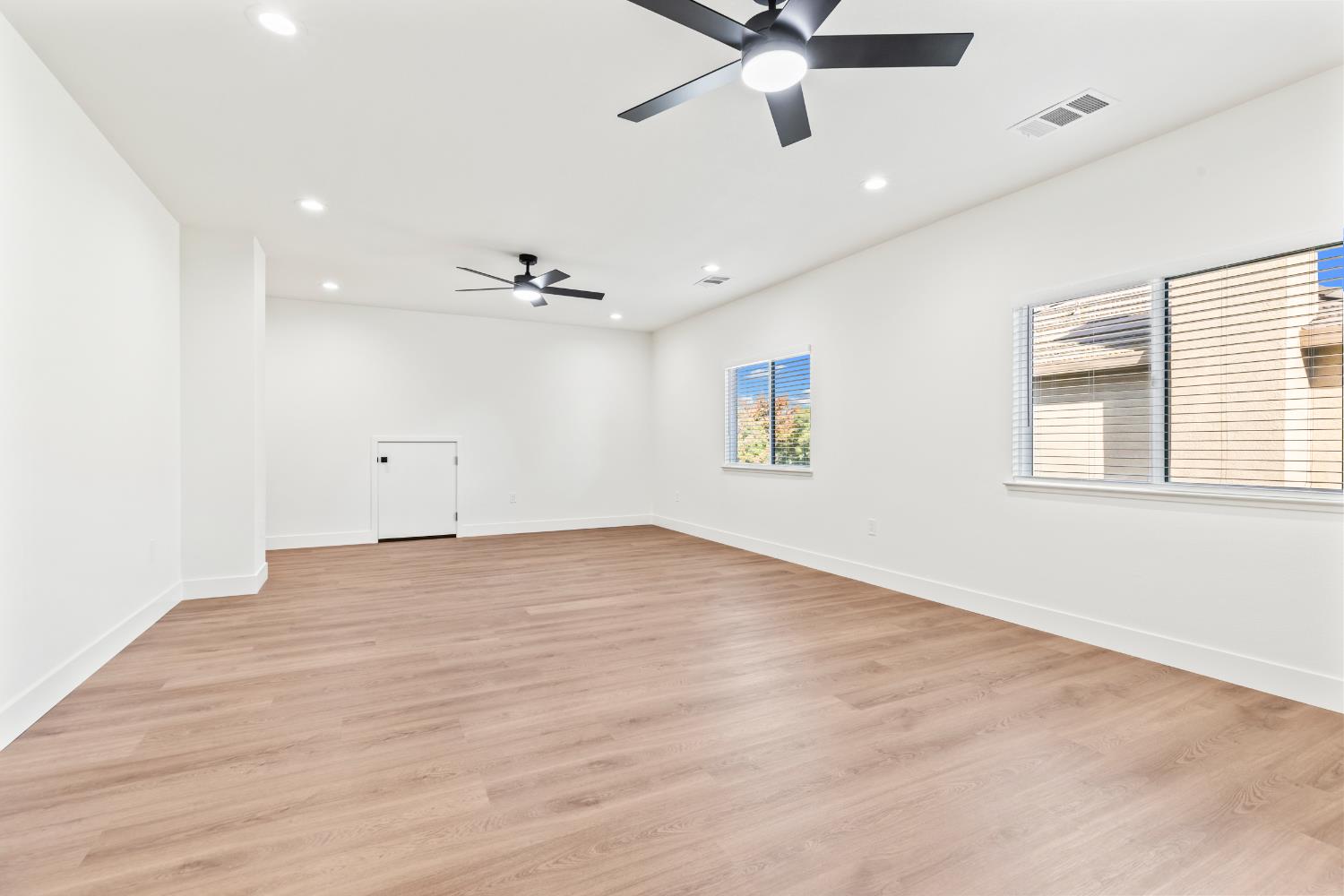 688 Cindy Drive Ripon, CA 95366 - Photo 40 of 57 wooden floor in an empty room with a window