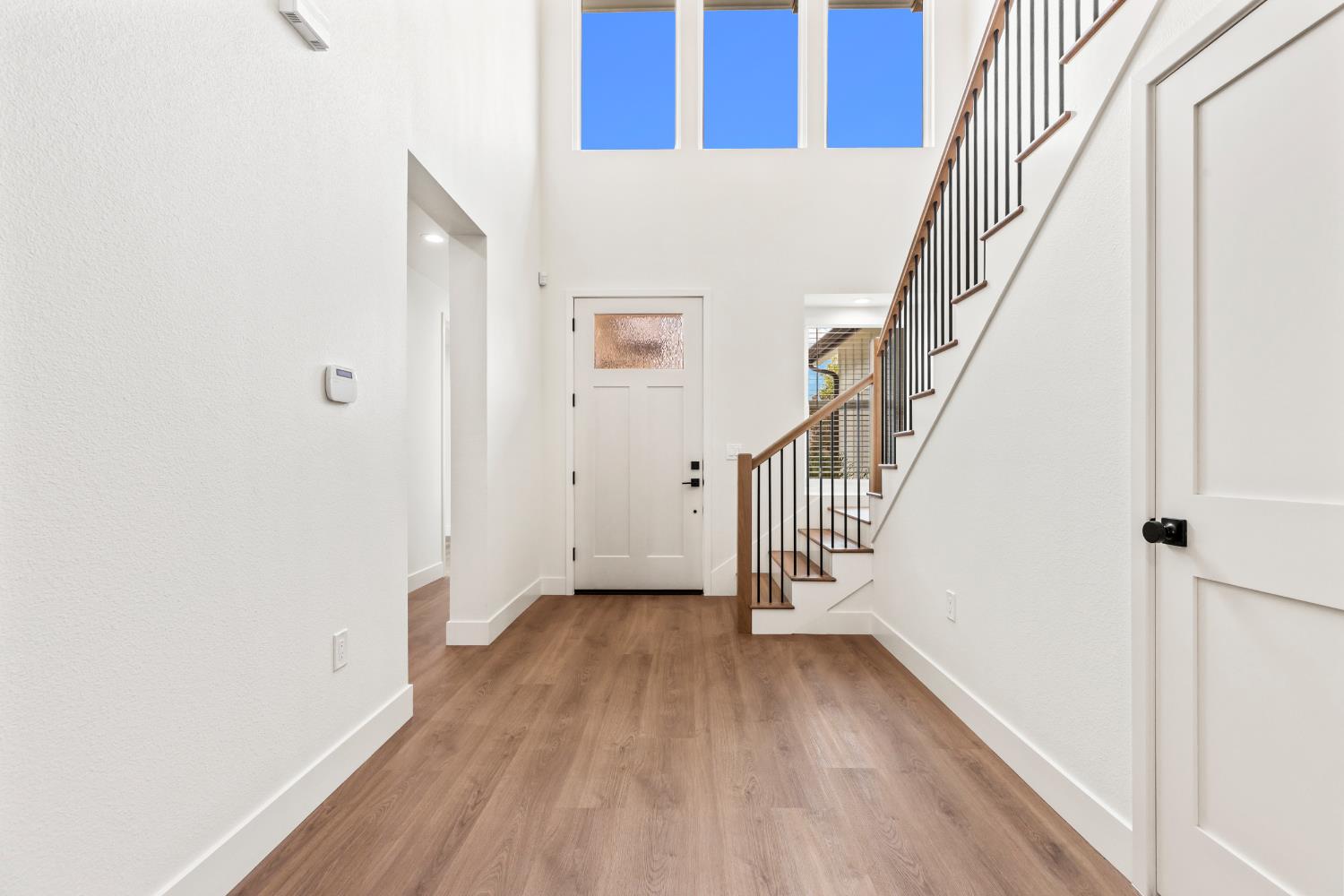 688 Cindy Drive Ripon, CA 95366 - Photo 5 of 57 a view of a hallway with wooden floor and entryway