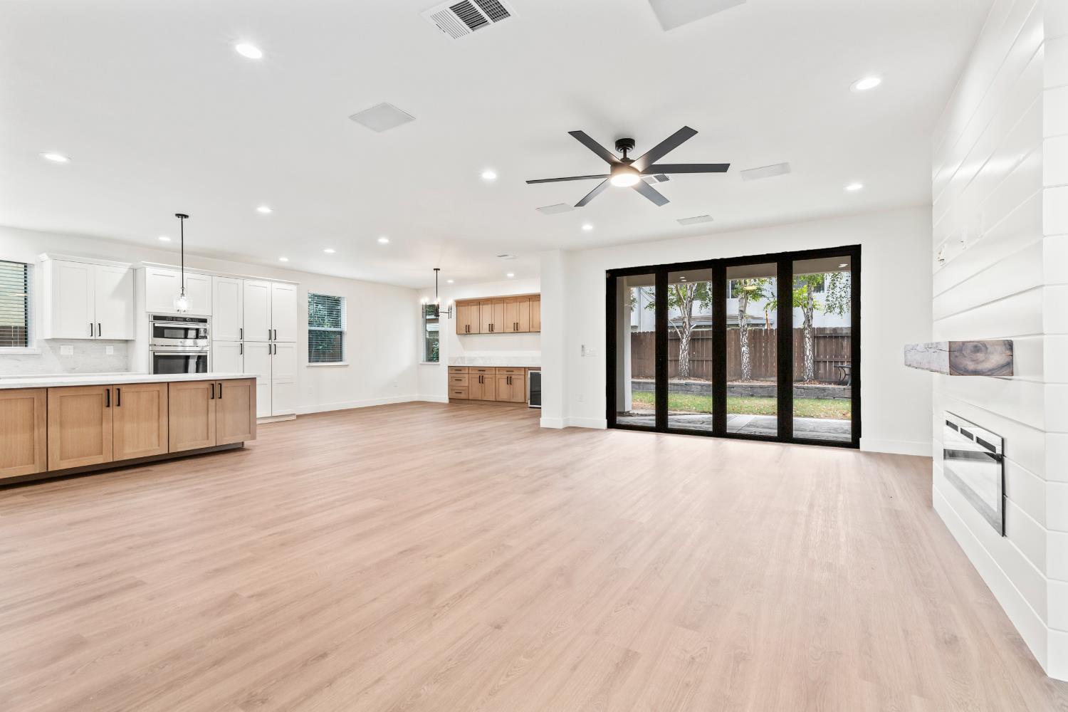 688 Cindy Drive Ripon, CA 95366 - Photo 6 of 57 a view of kitchen with wooden floor and window