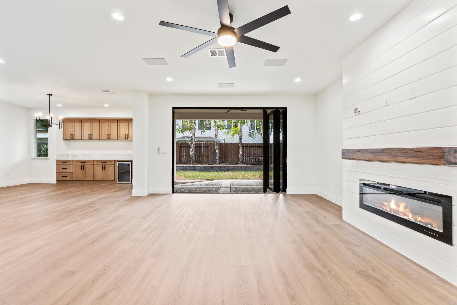 688 Cindy Drive Ripon, CA 95366 - Photo 9 of 57 an empty room with fireplace cabinet and windows