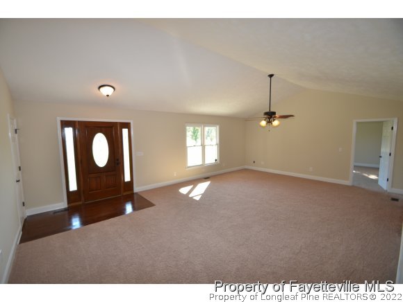 2651 Blossom Road Hope Mills, NC 28348 - Photo 11 of 25 a view of an empty room with window and wooden floor