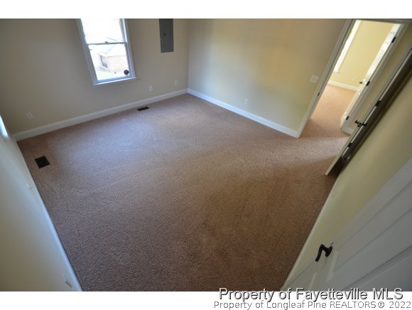 2651 Blossom Road Hope Mills, NC 28348 - Photo 14 of 25 a view of an empty room with windows