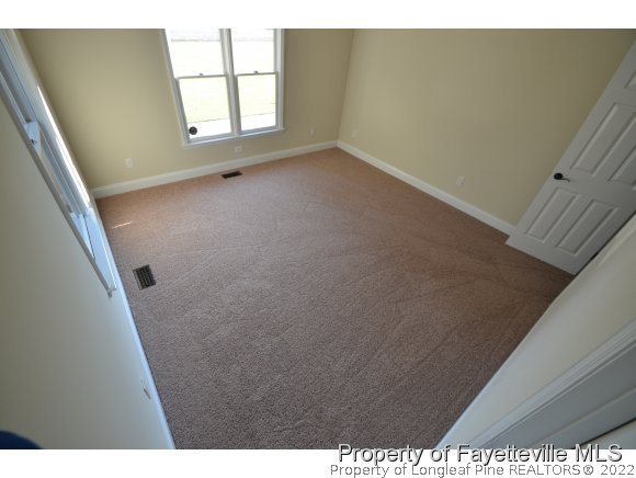 2651 Blossom Road Hope Mills, NC 28348 - Photo 16 of 25 a view of an empty room with a window
