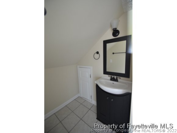 2651 Blossom Road Hope Mills, NC 28348 - Photo 19 of 25 a bathroom with a sink and a mirror