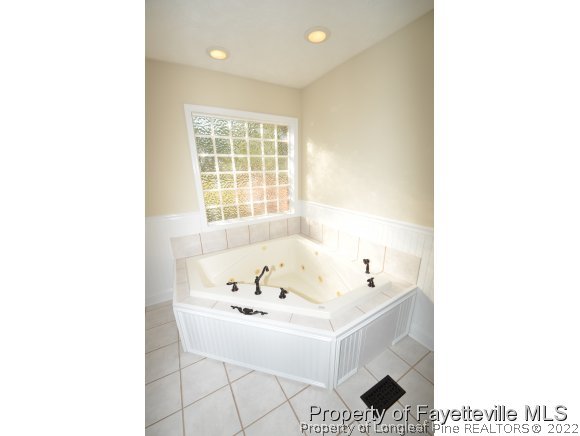 2651 Blossom Road Hope Mills, NC 28348 - Photo 20 of 25 a bathroom with a sink and a bathtub