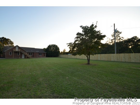 2651 Blossom Road Hope Mills, NC 28348 - Photo 23 of 25 a view of a green field