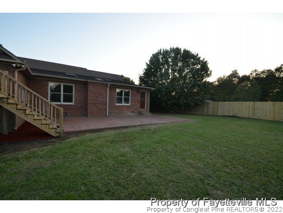 2651 Blossom Road Hope Mills, NC 28348 - Photo 24 of 25 a backyard of a house with lots of green space