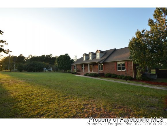 2651 Blossom Road Hope Mills, NC 28348 - Photo 25 of 25 a view of a big yard with a house