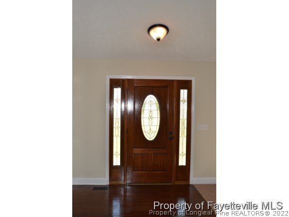 2651 Blossom Road Hope Mills, NC 28348 - Photo 4 of 25 a view of a mirror in a room