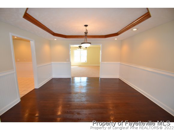 2651 Blossom Road Hope Mills, NC 28348 - Photo 10 of 25 a view of a hallway with wooden floor