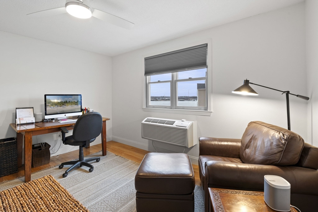 121 Water Street, Unit 44 Beverly, MA 01915 - Photo 15 of 24 a living room with furniture and a window