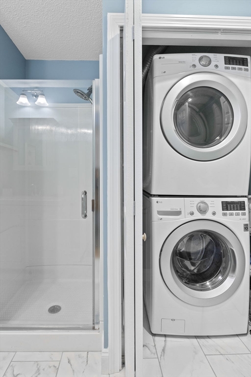 121 Water Street, Unit 44 Beverly, MA 01915 - Photo 17 of 24 a utility room with dryer and washer