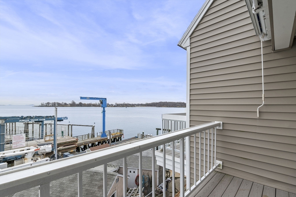 121 Water Street, Unit 44 Beverly, MA 01915 - Photo 20 of 24 a view of a balcony with wooden floor and fence