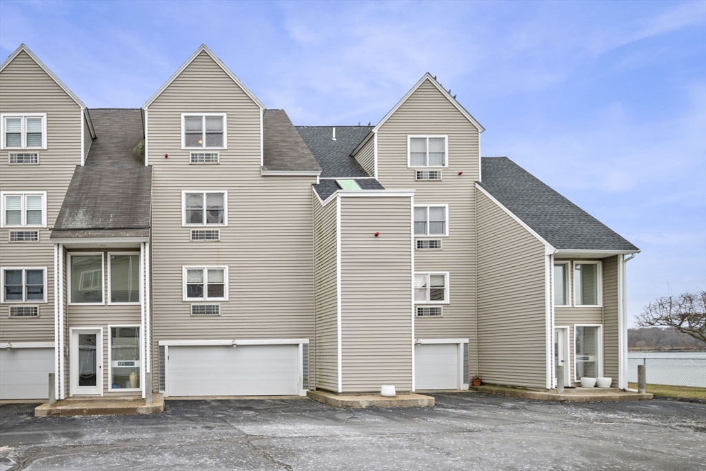 121 Water Street, Unit 44 Beverly, MA 01915 - Photo 22 of 24 a front view of a house with a yard