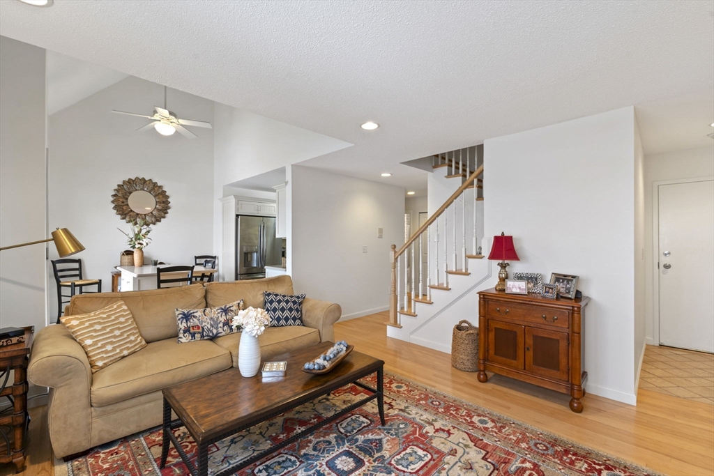 121 Water Street, Unit 44 Beverly, MA 01915 - Photo 3 of 24 a living room with furniture and wooden floor