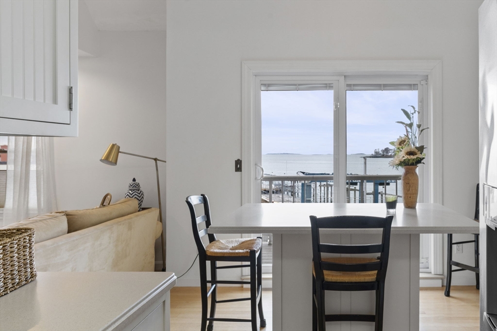 121 Water Street, Unit 44 Beverly, MA 01915 - Photo 6 of 24 a dining room with furniture and a window