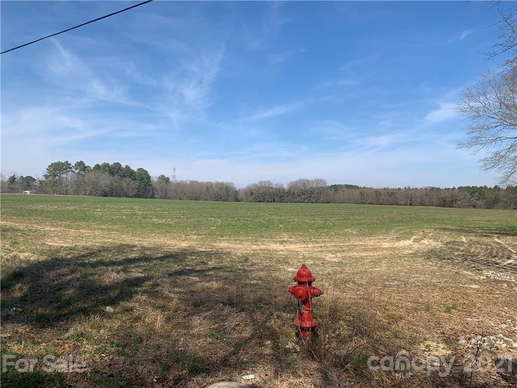 688 McLendon Road Morven, NC 28119 - Photo 3 of 9 a view of a lake with a city