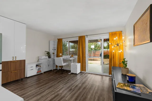 a room with furniture and wooden floor