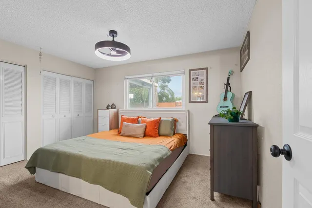 a bedroom with a bed and a window