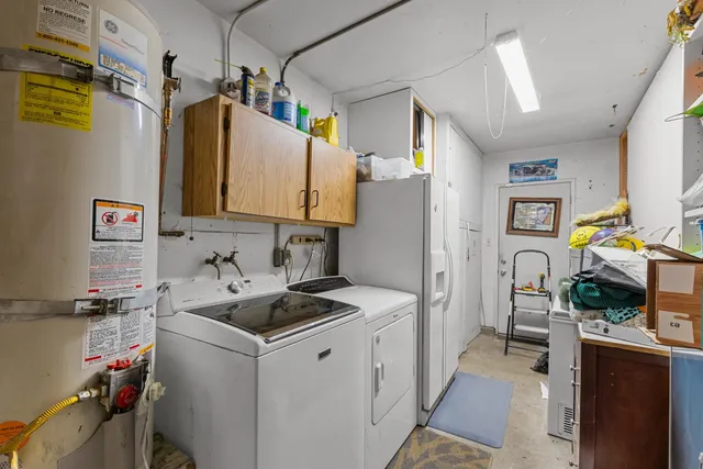 a kitchen that has a refrigerator and a stove