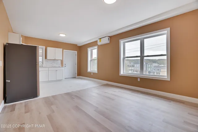 a view of an empty room with a window