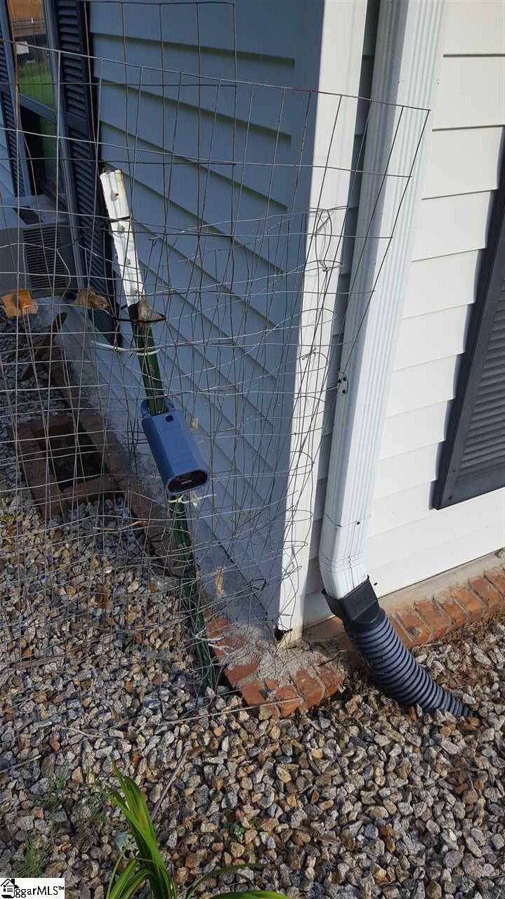 159 Oakvale Road Greenville, SC 29611 - Photo 14 of 34 Supra Key located on front left side of home on fence.