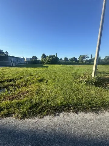 a view of a lake with houses in the back