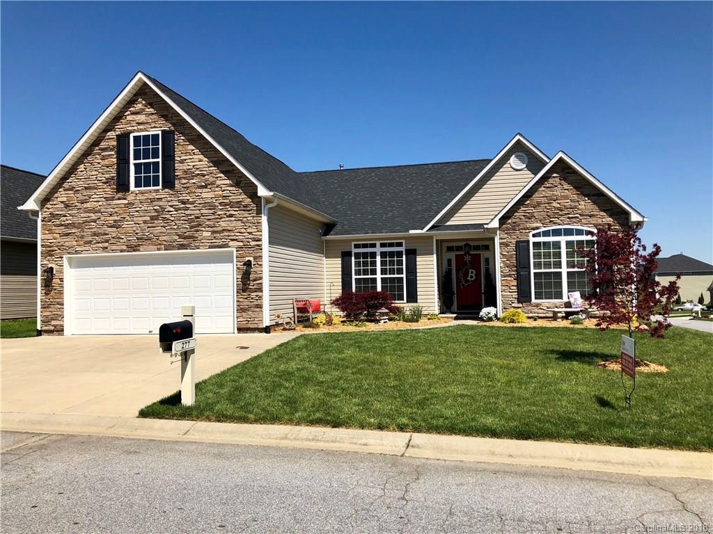 277 Yadkin Road Fletcher, NC 28732 - Photo 1 of 15 a front view of a house with a yard