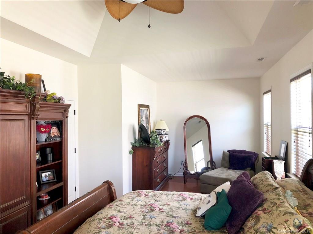 277 Yadkin Road Fletcher, NC 28732 - Photo 12 of 15 a bedroom with a bed and dresser