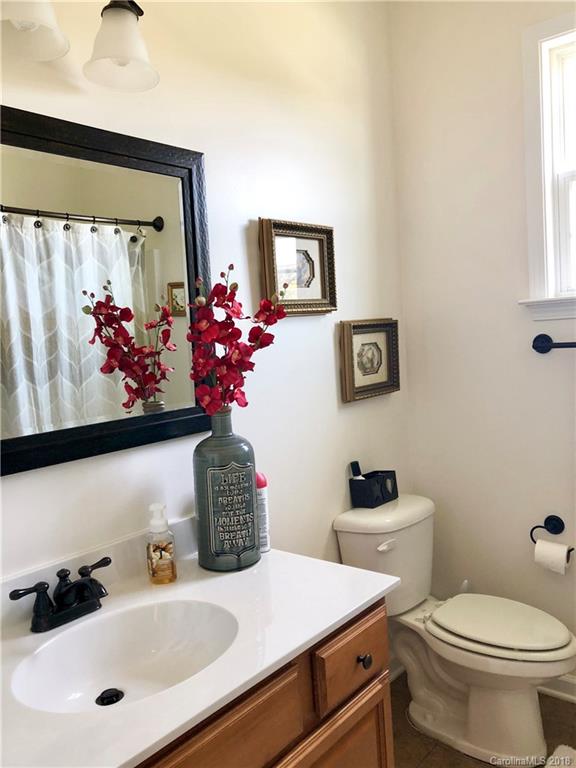 277 Yadkin Road Fletcher, NC 28732 - Photo 9 of 15 a bathroom with a sink mirror and toilet