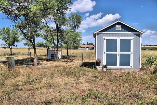 6095 West Condor Road Peyton, CO 80831 - Photo 26 of 33 10' x 12' Tuff Shed.