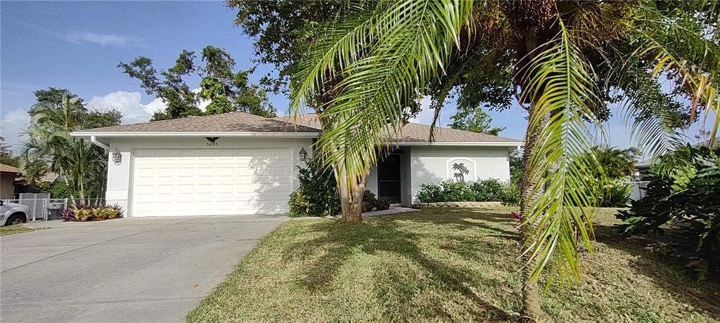 5295 Drew Road Venice, FL 34293 - Photo 1 of 1 a front view of a house with a yard and garage