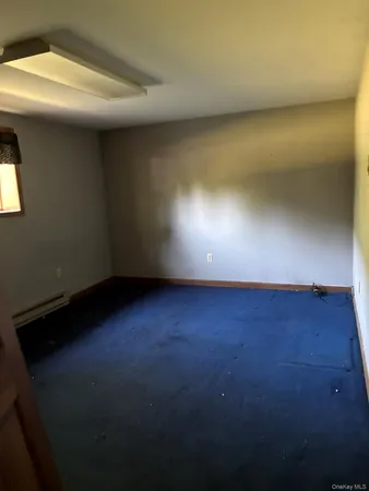 a living room with a furniture and a window