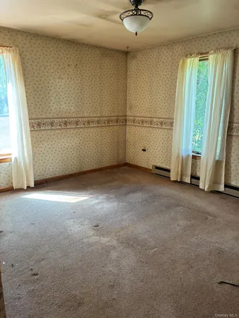 an empty room with windows