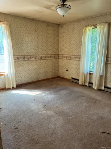 an empty room with windows