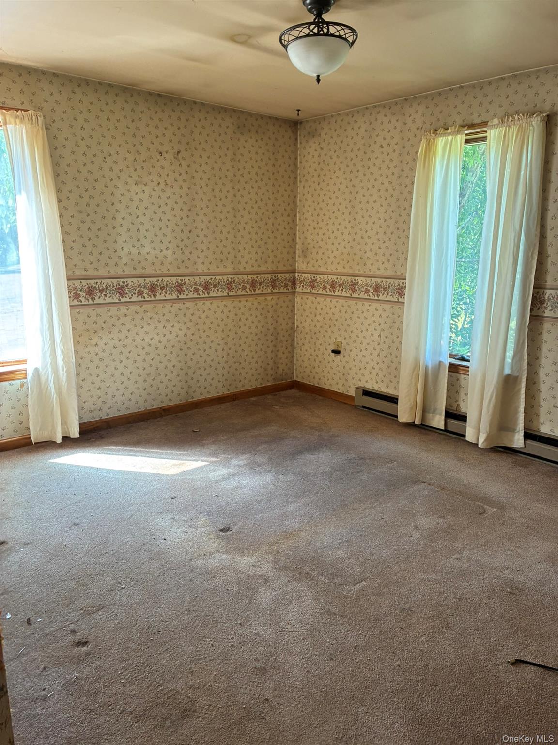 1140 Harvard Road East Branch, NY 13756 - Photo 5 of 29 an empty room with windows