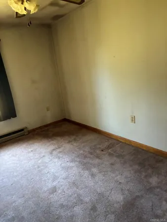 a view of a room with a bench