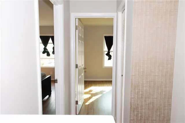 a view of a bathroom from a corridor