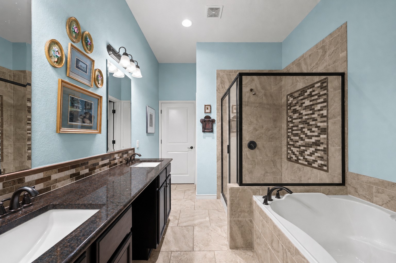 204 Adams Street Georgetown, TX 78628 - Photo 21 of 33 Indulge in a tranquil bathing experience with a large soaking tub and separate shower in this primary bath.