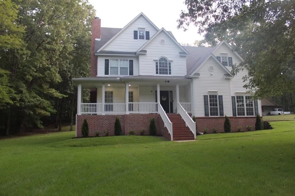 440 Stewart Road Eads, TN 38028 - Photo 1 of 25 View of front property with a porch and a front yard