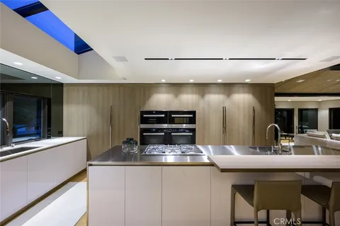 a kitchen with a sink and a refrigerator