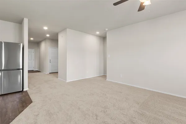 a kitchen with stainless steel appliances granite countertop a sink stove microwave and refrigerator