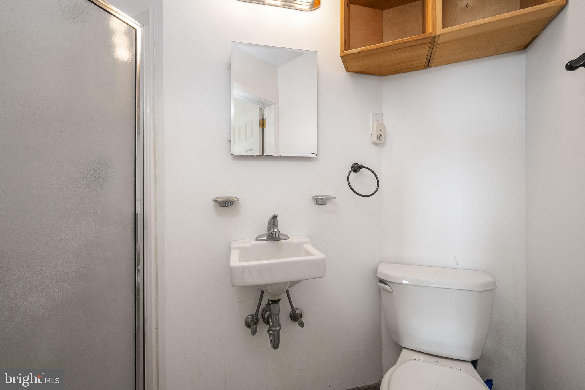 146 Ross Road King of Prussia, PA 19406 - Photo 13 of 27 a bathroom with a toilet a sink and mirror